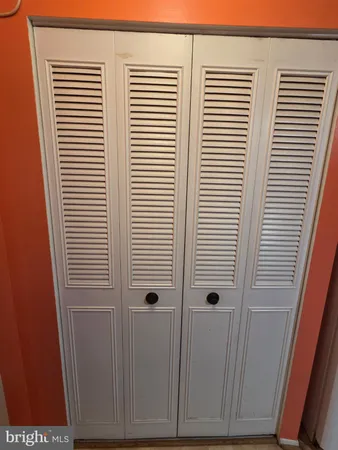 a bathroom with a toilet and a bathtub