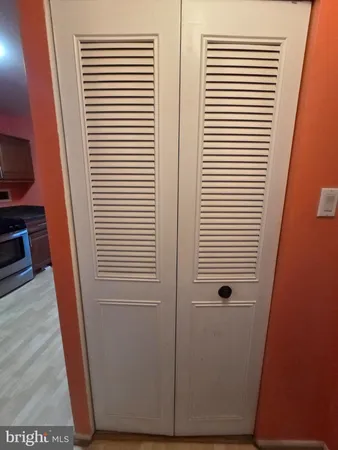 a bathroom with a sink a toilet a mirror and tub