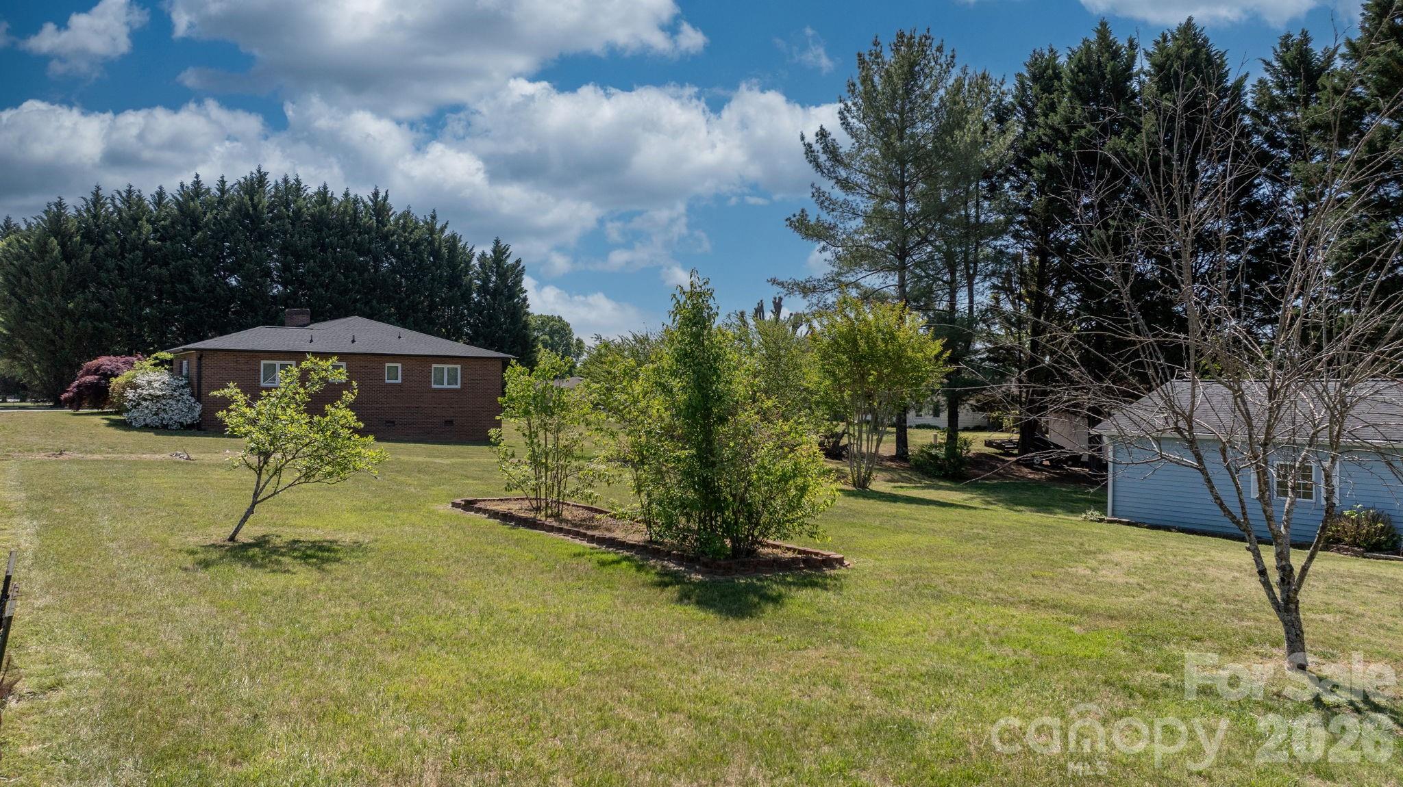 65 Pinewood Road Granite Falls, NC 28630 - Photo 11 of 42 a view of a park with a slide