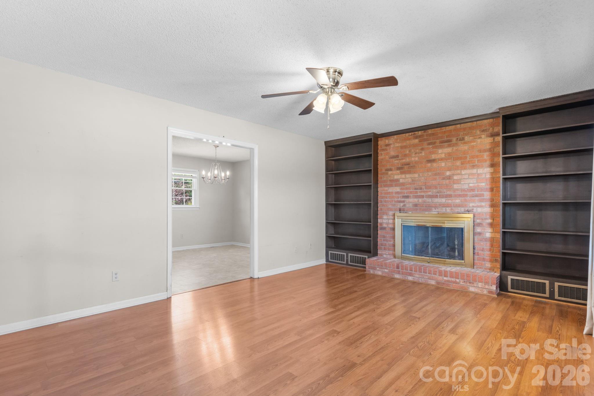 65 Pinewood Road Granite Falls, NC 28630 - Photo 18 of 42 a view of an empty room with a window and fireplace
