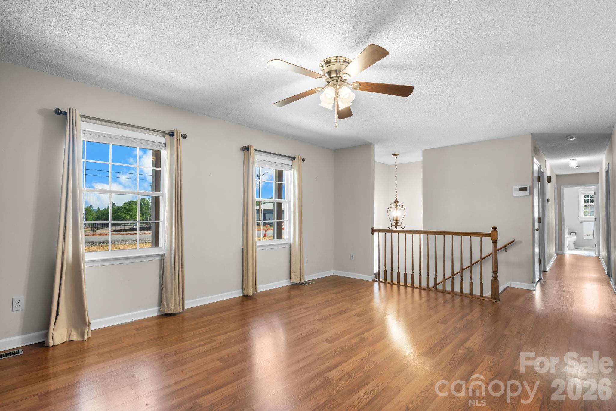 65 Pinewood Road Granite Falls, NC 28630 - Photo 19 of 42 a view of an empty room with wooden floor and a window