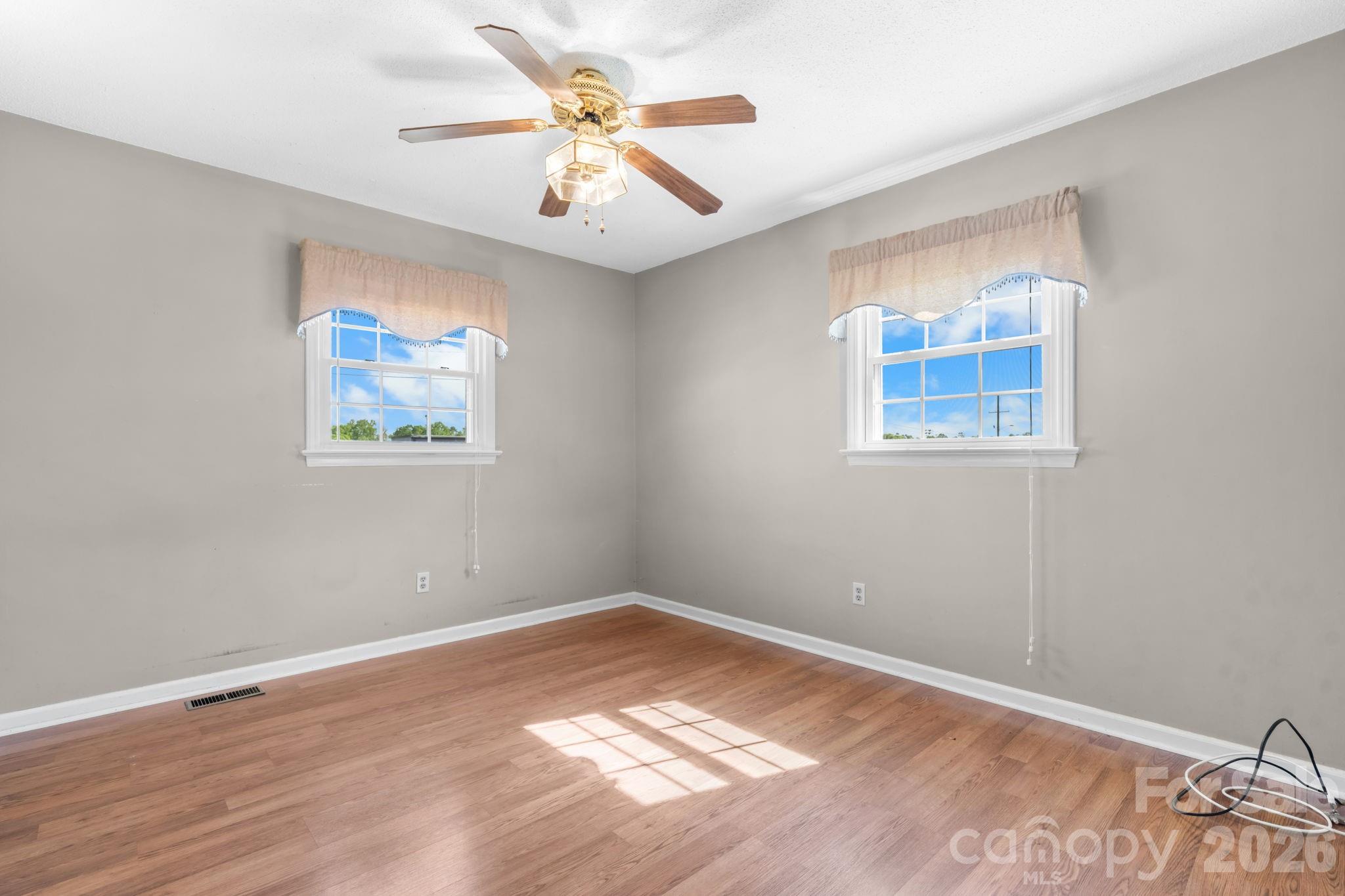 65 Pinewood Road Granite Falls, NC 28630 - Photo 25 of 42 a view of a big room with wooden floor and a window