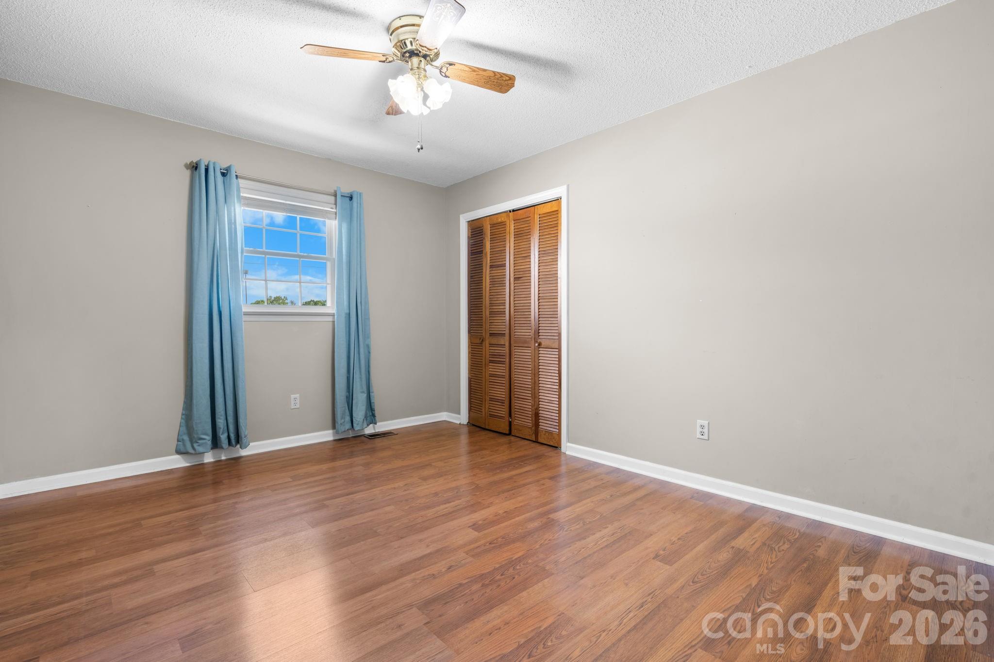 65 Pinewood Road Granite Falls, NC 28630 - Photo 26 of 42 a view of an empty room with wooden floor
