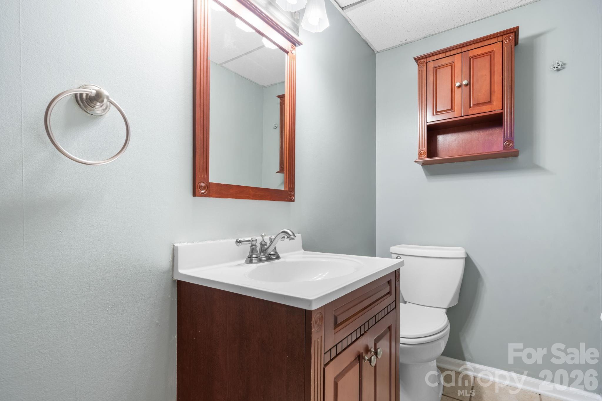 65 Pinewood Road Granite Falls, NC 28630 - Photo 32 of 42 a bathroom with a sink and a mirror