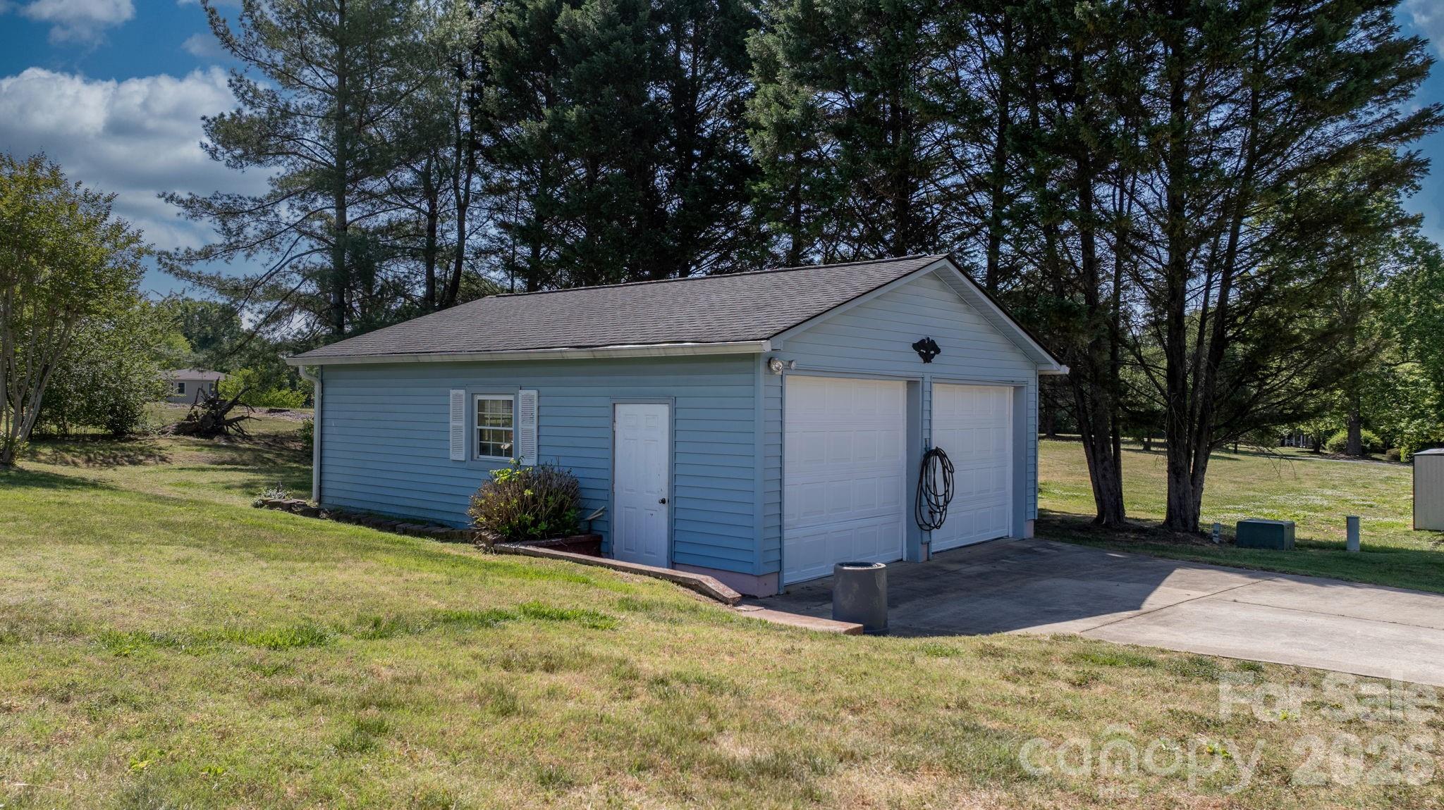 65 Pinewood Road Granite Falls, NC 28630 - Photo 35 of 42 a front view of house with yard and trees