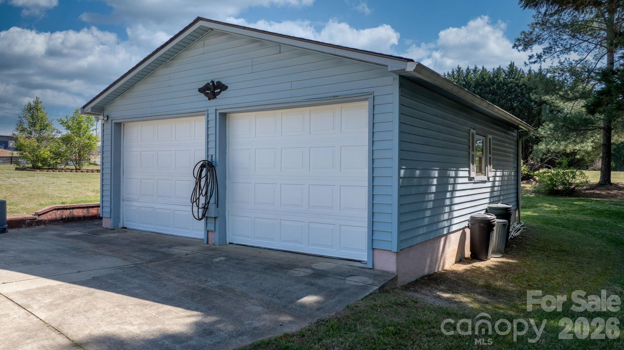 65 Pinewood Road Granite Falls, NC 28630 - Photo 36 of 42 a view of a small house with a yard