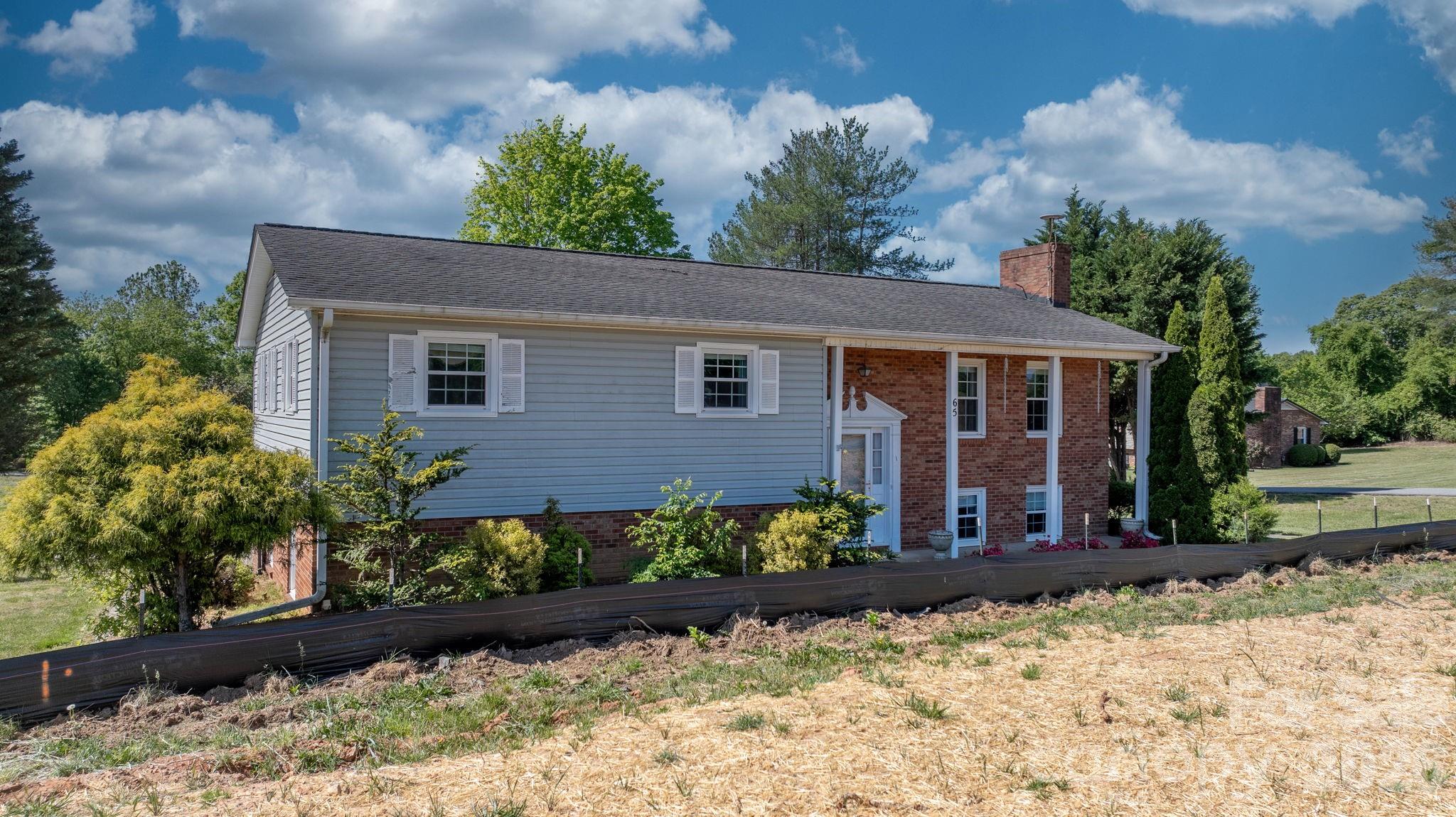 65 Pinewood Road Granite Falls, NC 28630 - Photo 4 of 42 front view of a house with a yard