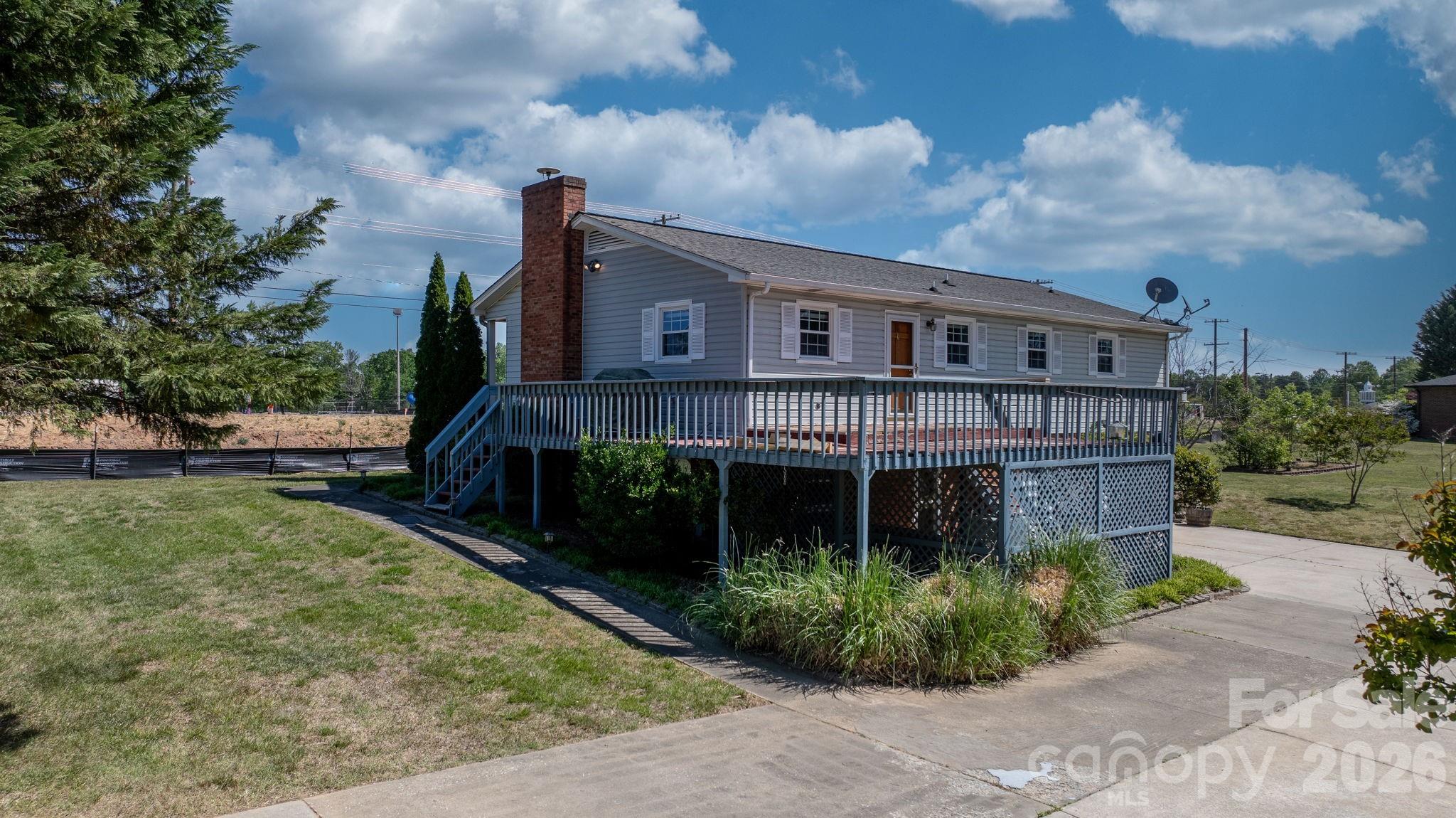 65 Pinewood Road Granite Falls, NC 28630 - Photo 10 of 42 a front view of a house with garden