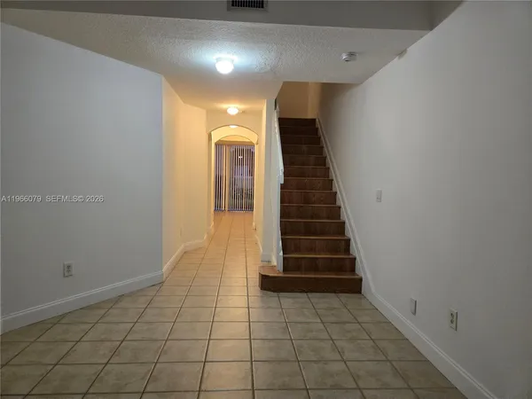 a view of entryway with stairs