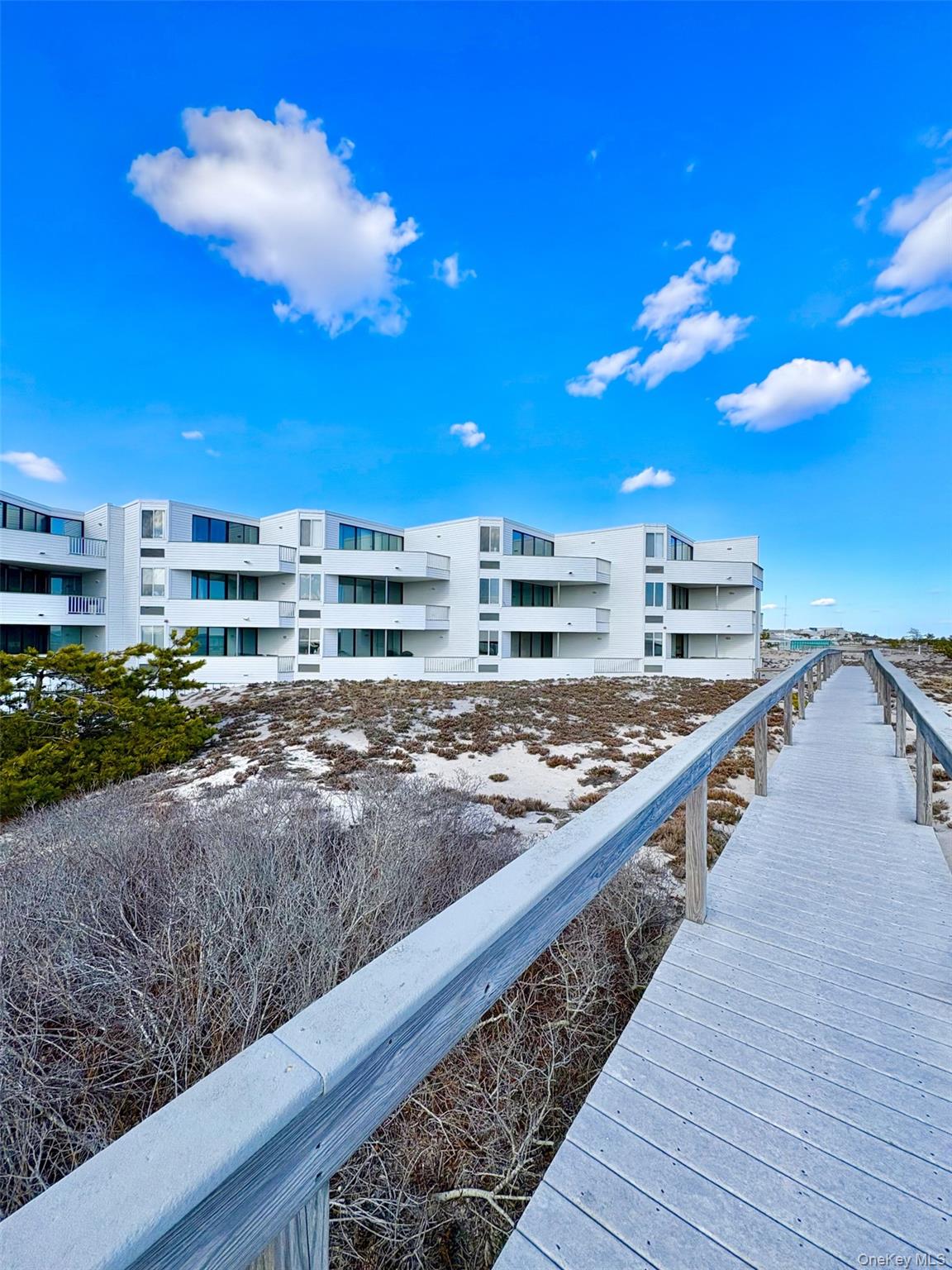 253 Dune Road, Unit 49 Westhampton Beach, NY 11978 - Photo 2 of 31 a view of a balcony