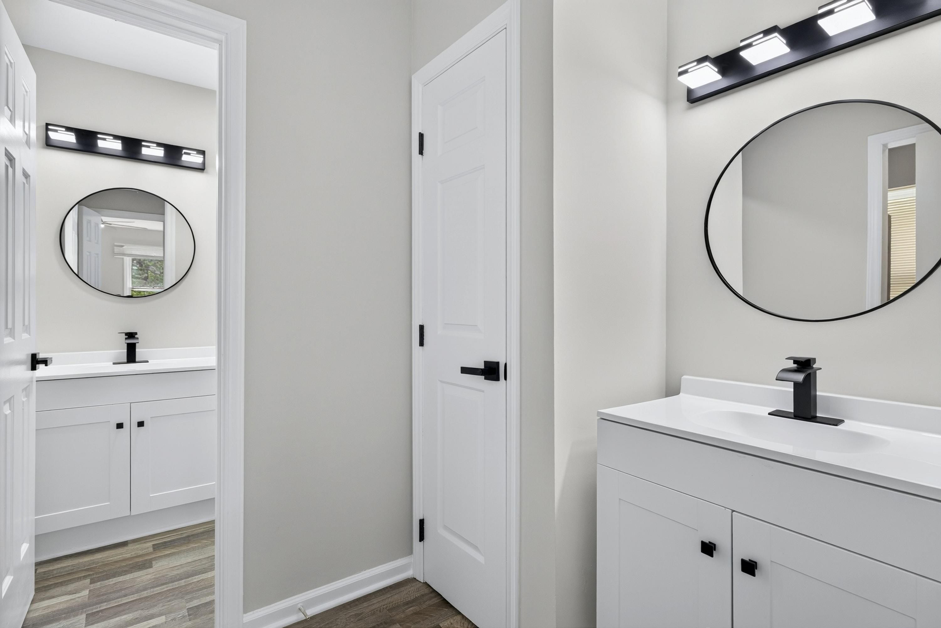 708 Powell Drive, Unit A Raleigh, NC 27606 - Photo 29 of 56 Primary Bath with separate vanities