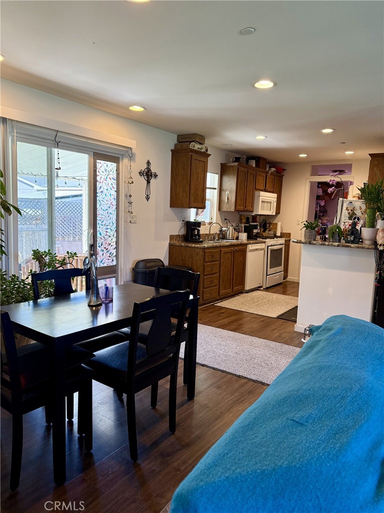 9200 Pinewood Court Atascadero, CA 93422 - Photo 13 of 26 a living room with stainless steel appliances kitchen island granite countertop furniture and wooden floor
