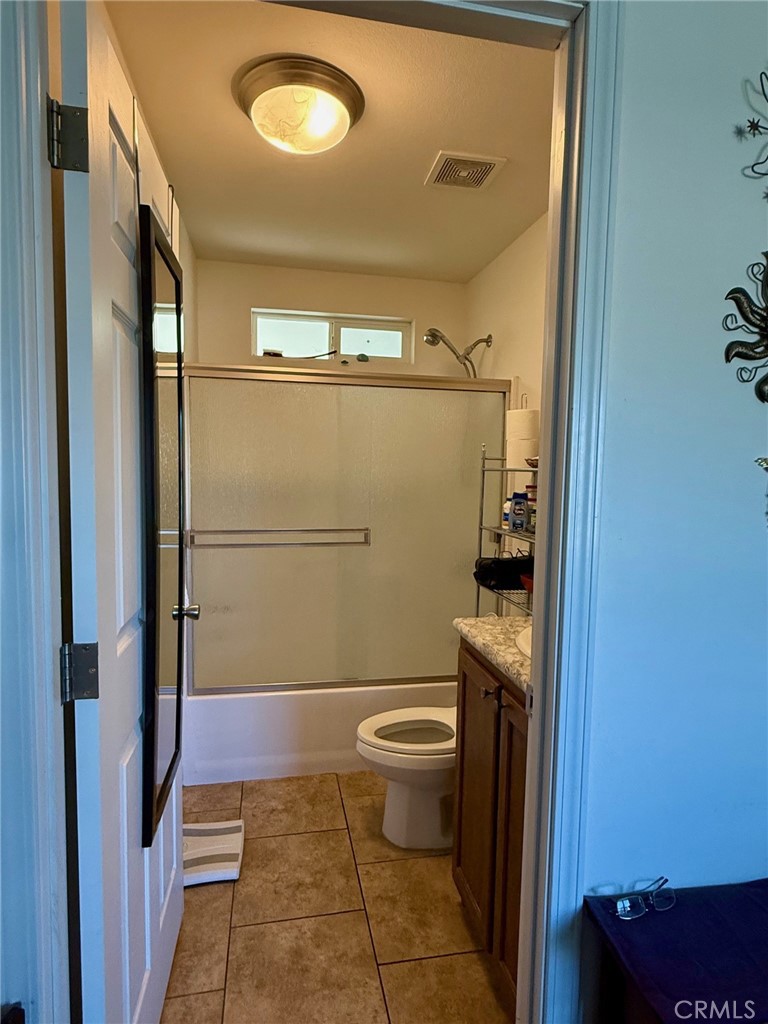 9200 Pinewood Court Atascadero, CA 93422 - Photo 19 of 26 a bathroom with a toilet and a shower