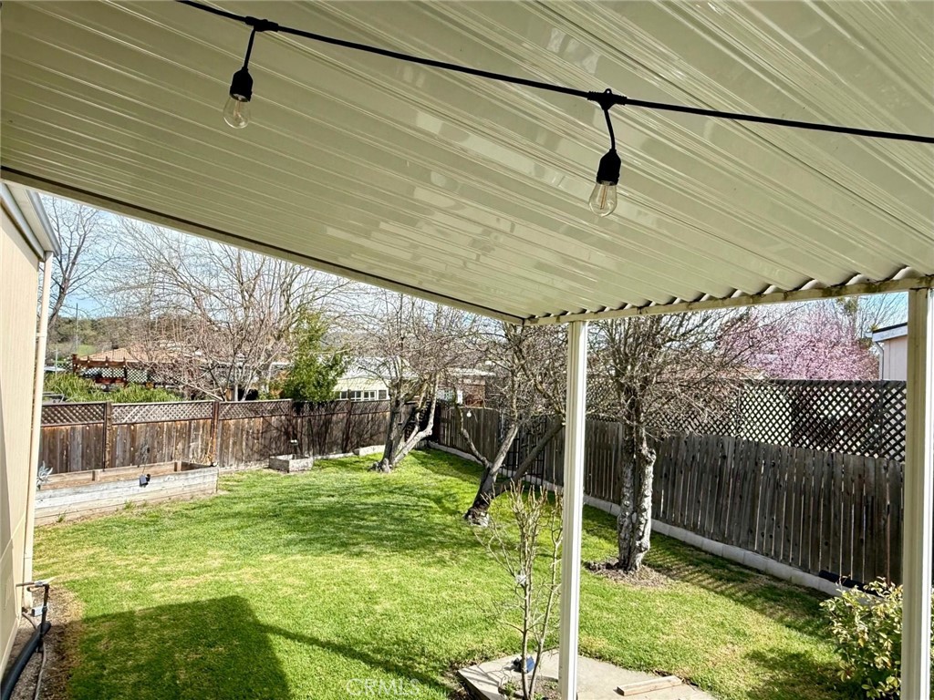 9200 Pinewood Court Atascadero, CA 93422 - Photo 3 of 26 a view of a house with backyard and a slide