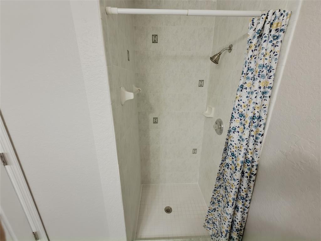 2202 Godfrey Avenue Spring Hill, FL 34609 - Photo 21 of 36 a bathroom with a shower