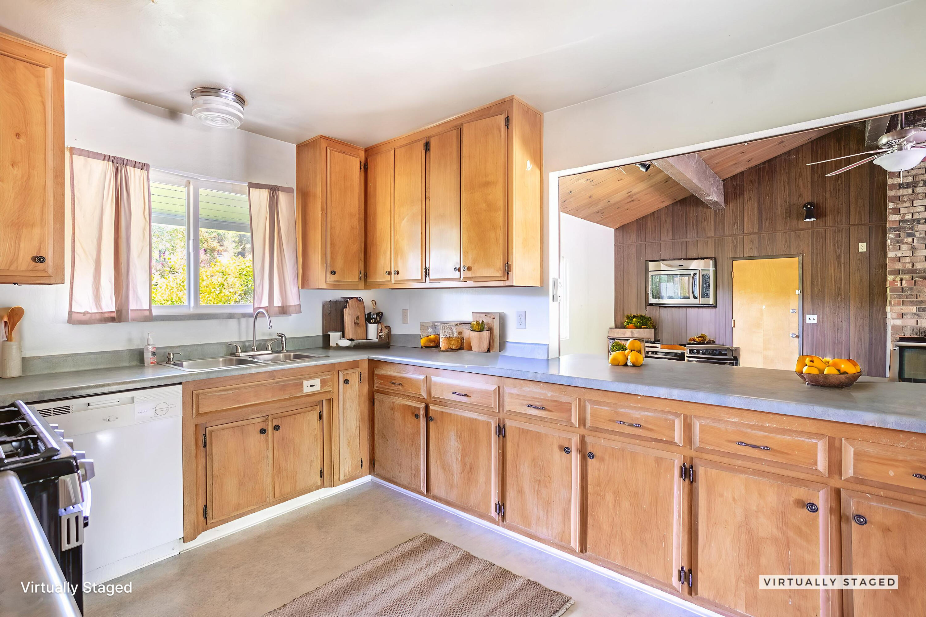 8415 Valley View Road Redding, CA 96001 - Photo 11 of 31 a kitchen with sink cabinets and window