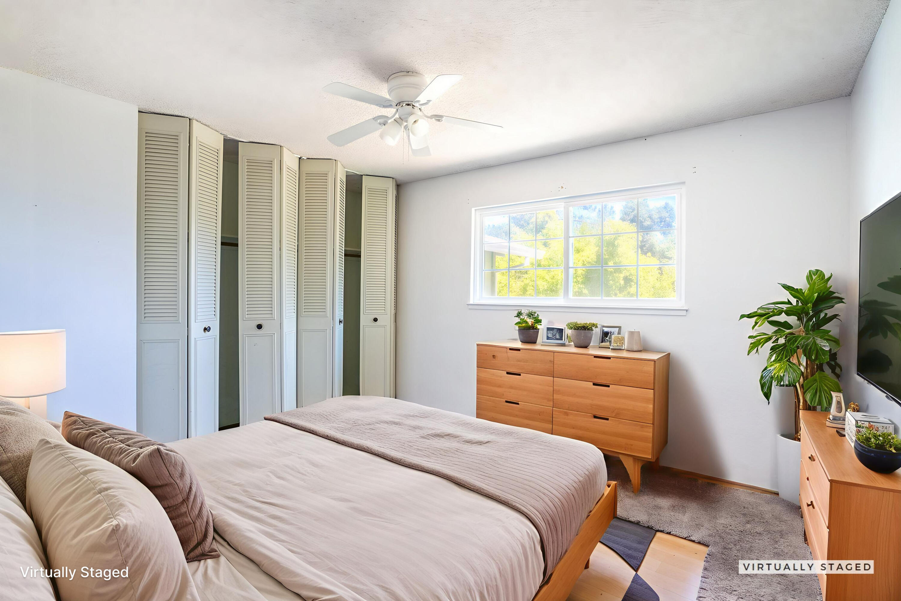 8415 Valley View Road Redding, CA 96001 - Photo 14 of 31 a bedroom with a bed and a potted plant