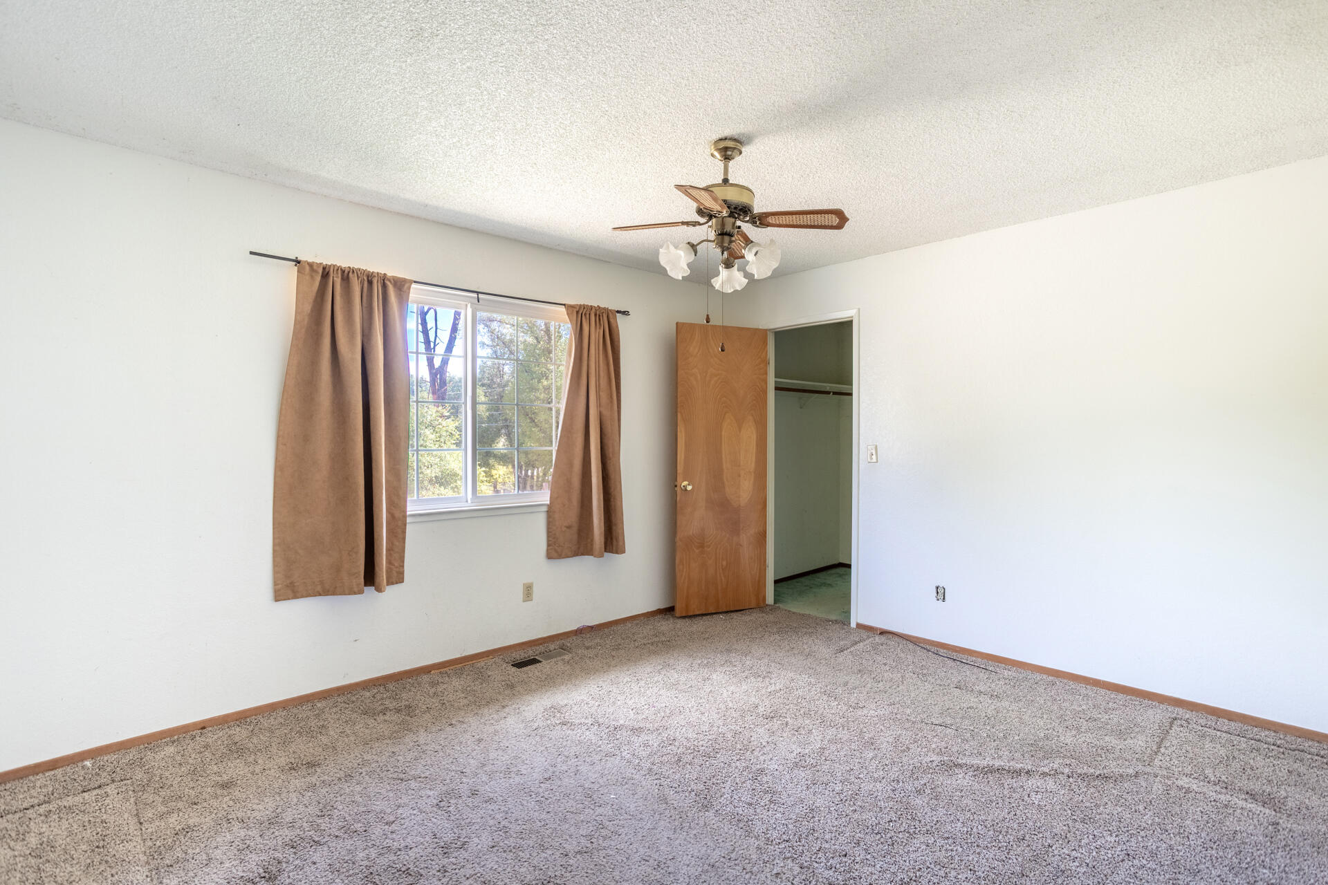 8415 Valley View Road Redding, CA 96001 - Photo 18 of 31 a view of an empty room with a window