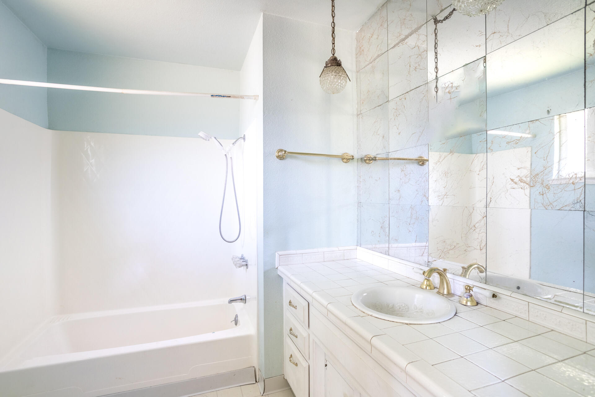 8415 Valley View Road Redding, CA 96001 - Photo 19 of 31 a bathroom with a granite countertop sink and a mirror