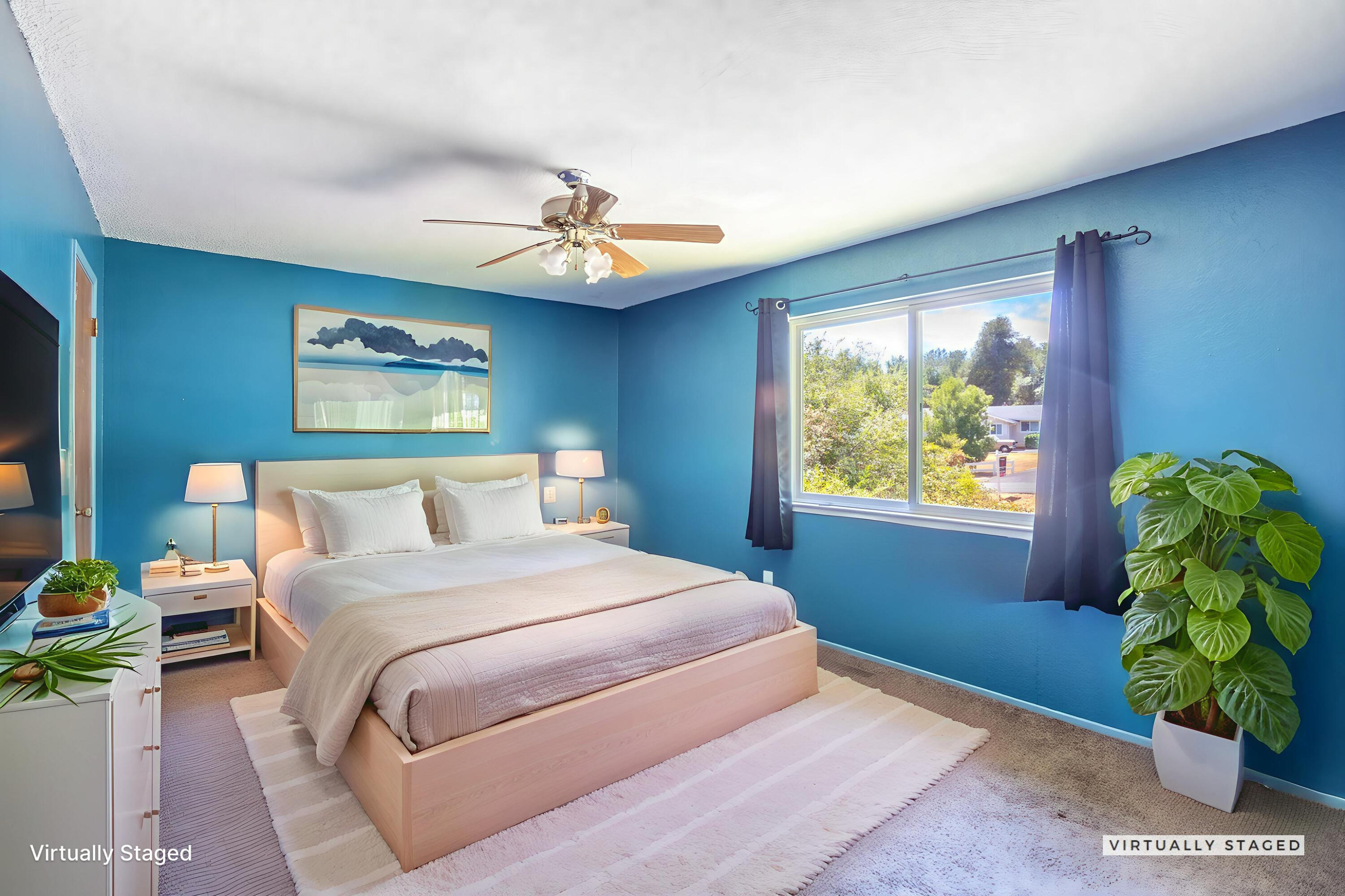 8415 Valley View Road Redding, CA 96001 - Photo 20 of 31 a bedroom with a bed and a chandelier