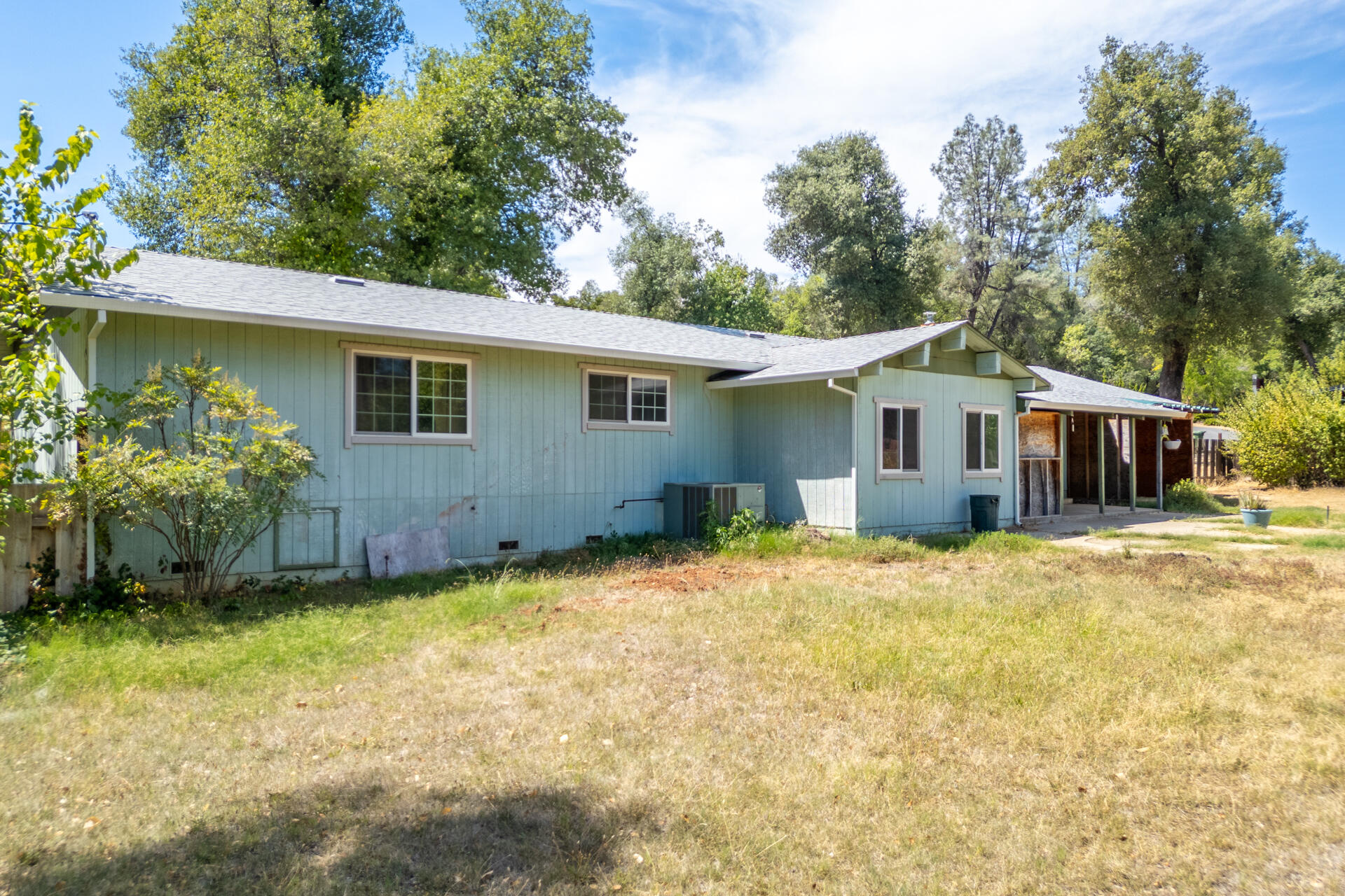 8415 Valley View Road Redding, CA 96001 - Photo 22 of 31 a front view of house with yard and trees