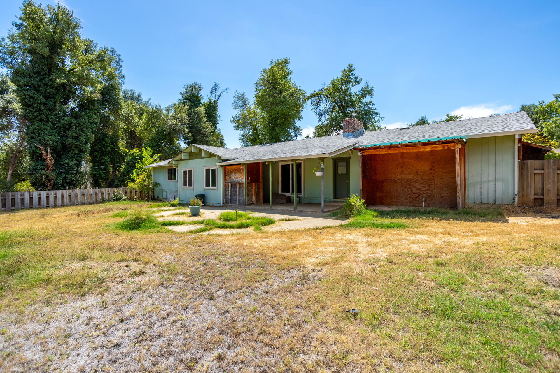 8415 Valley View Road Redding, CA 96001 - Photo 23 of 31 a front view of a house with a yard