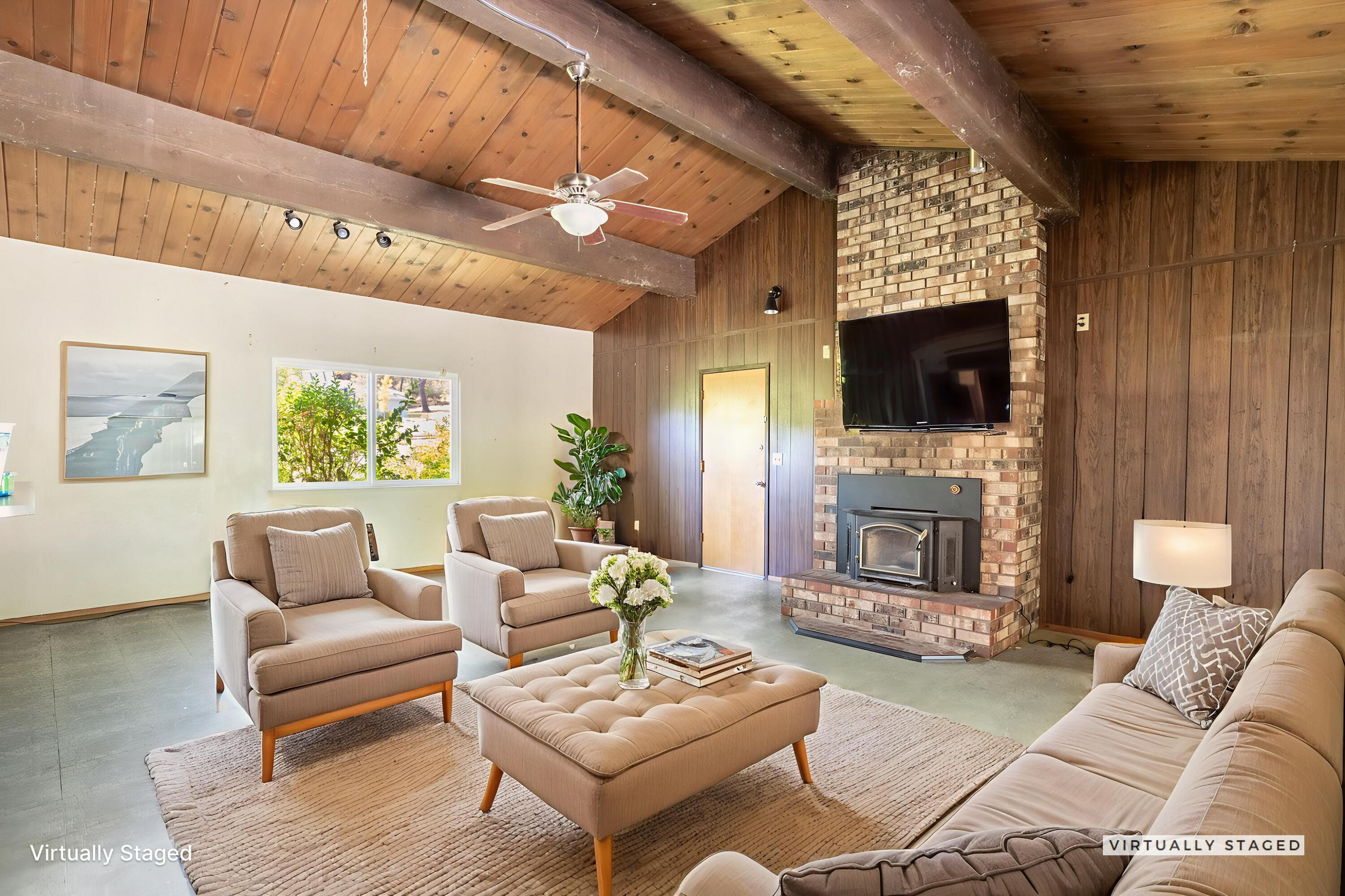 8415 Valley View Road Redding, CA 96001 - Photo 4 of 31 a living room with furniture a fireplace and a flat screen tv