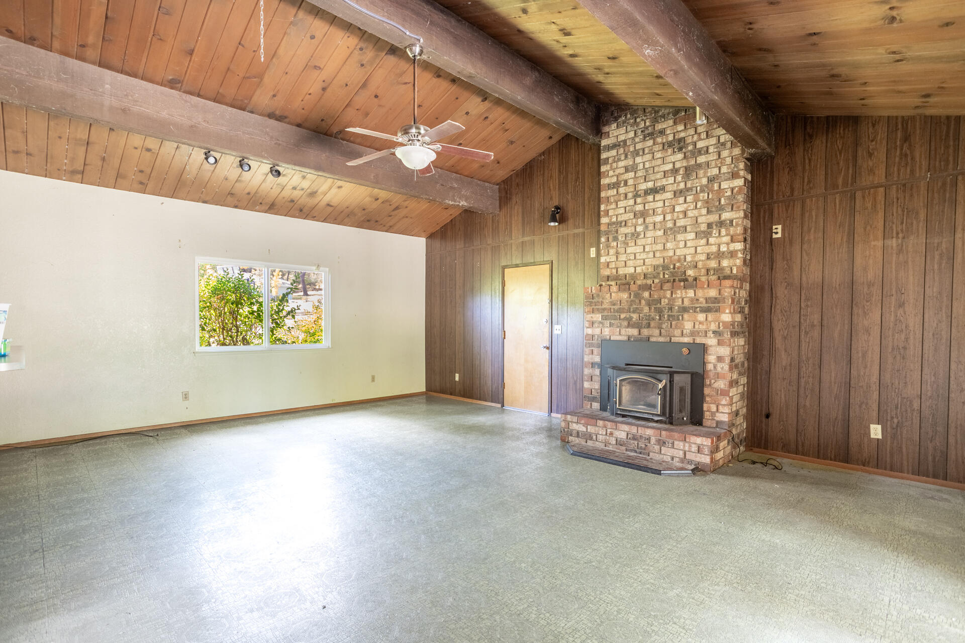 8415 Valley View Road Redding, CA 96001 - Photo 5 of 31 an empty room with windows