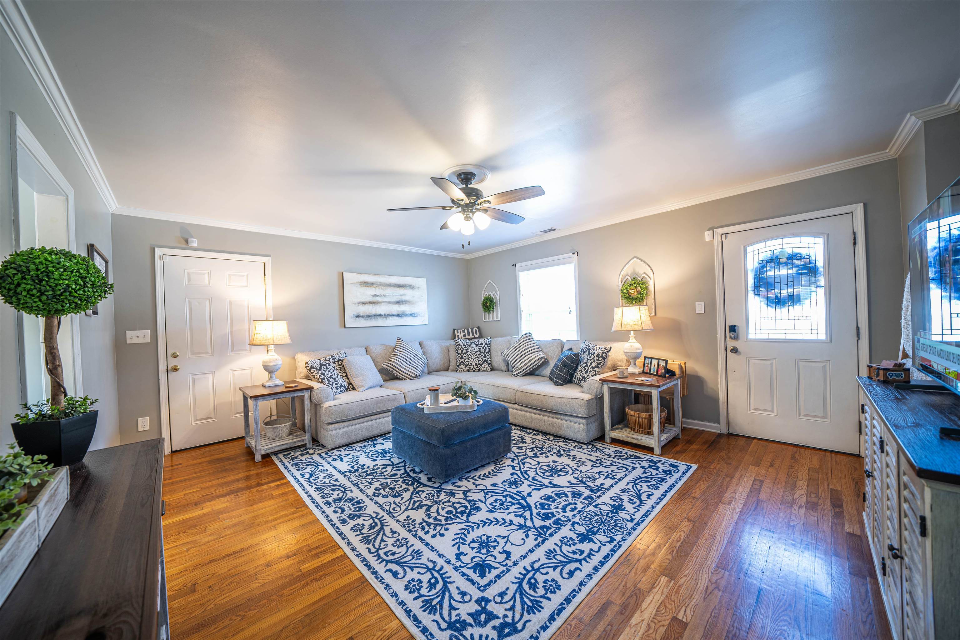 5163 Kaye Road Memphis, TN 38117 - Photo 7 of 23 Living room featuring ceiling fan, ornamental molding, and dark wood-type flooring