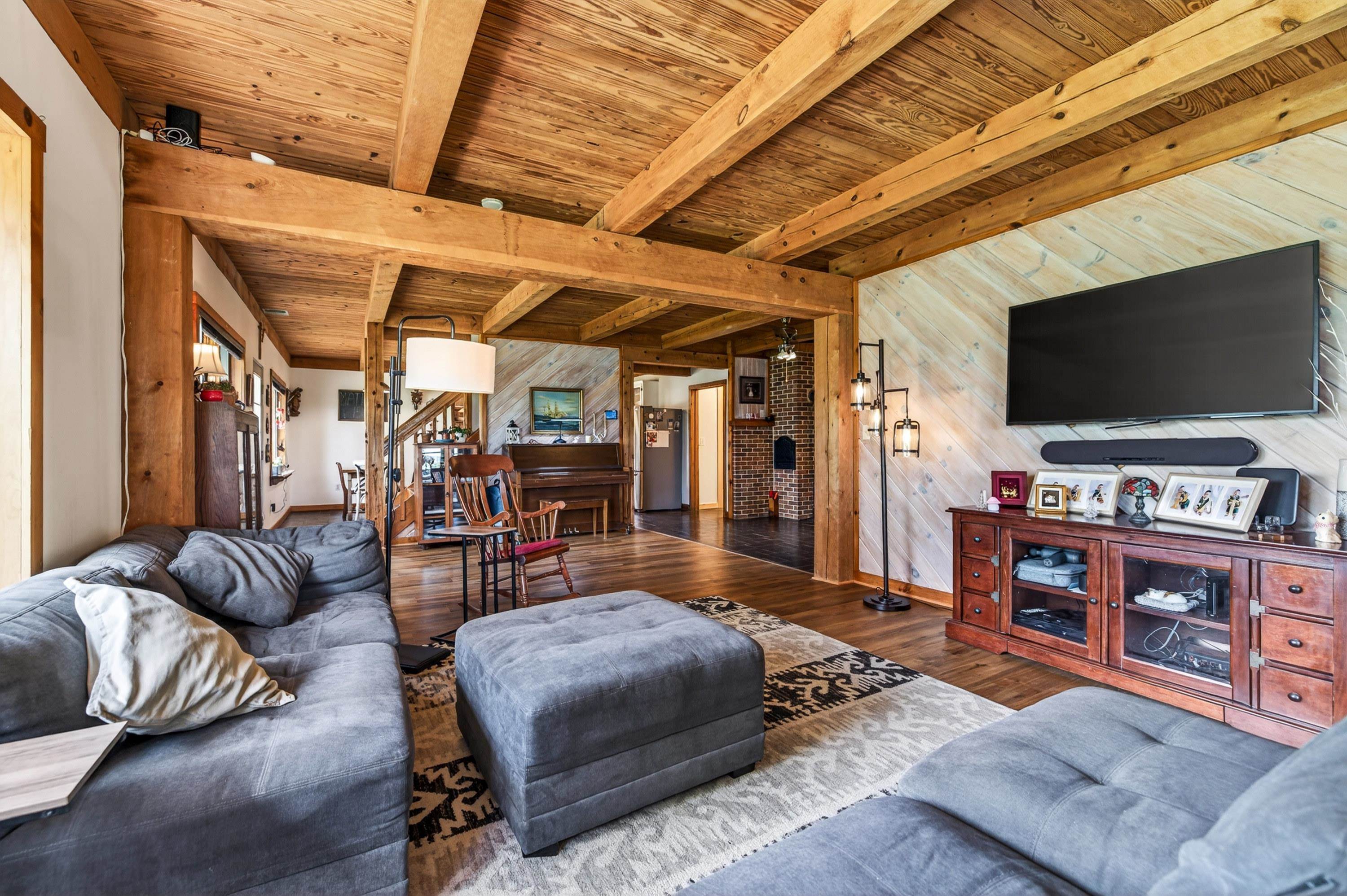 3980 Greenmount Road Harrisonburg, VA 22802 - Photo 12 of 75 The living room is expansive and features hardwood flooring, large windows, decorative ceilings, and plenty of space for gathering with family and friends.