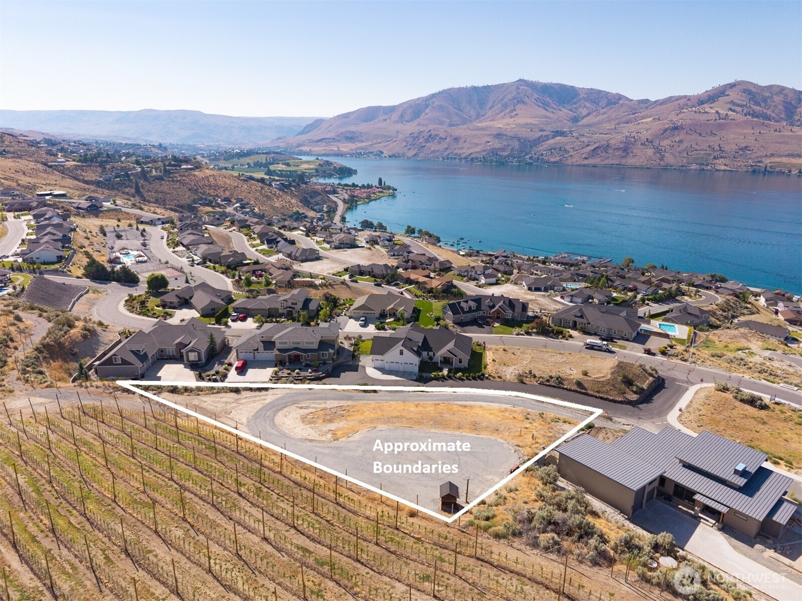 101 Lake Ridge Drive Chelan, WA 98816 - Photo 2 of 23 an aerial view of residential house and lake view