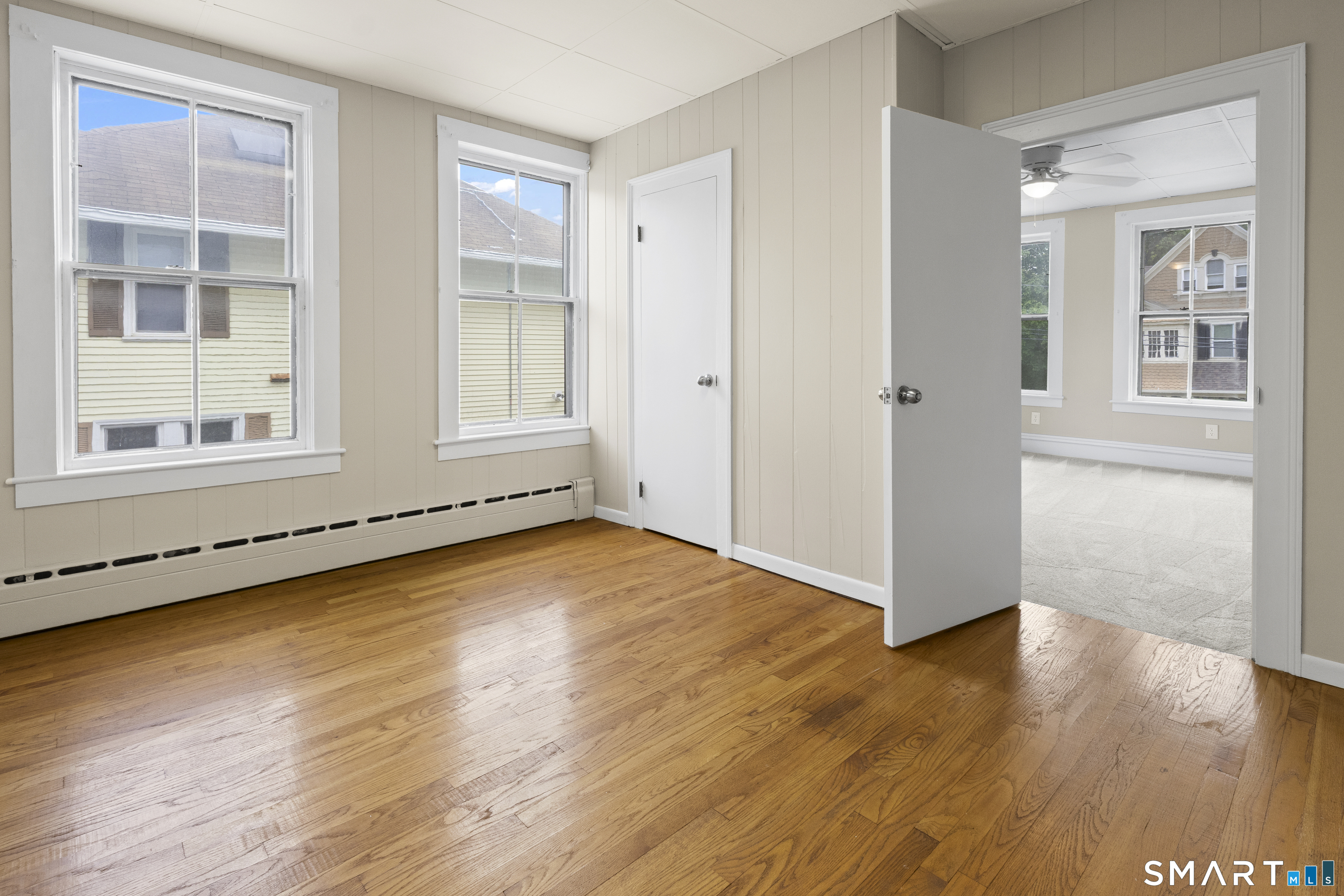 198 South Main Street Putnam, CT 06260 - Photo 16 of 21 a view of an empty room with wooden floor and windows