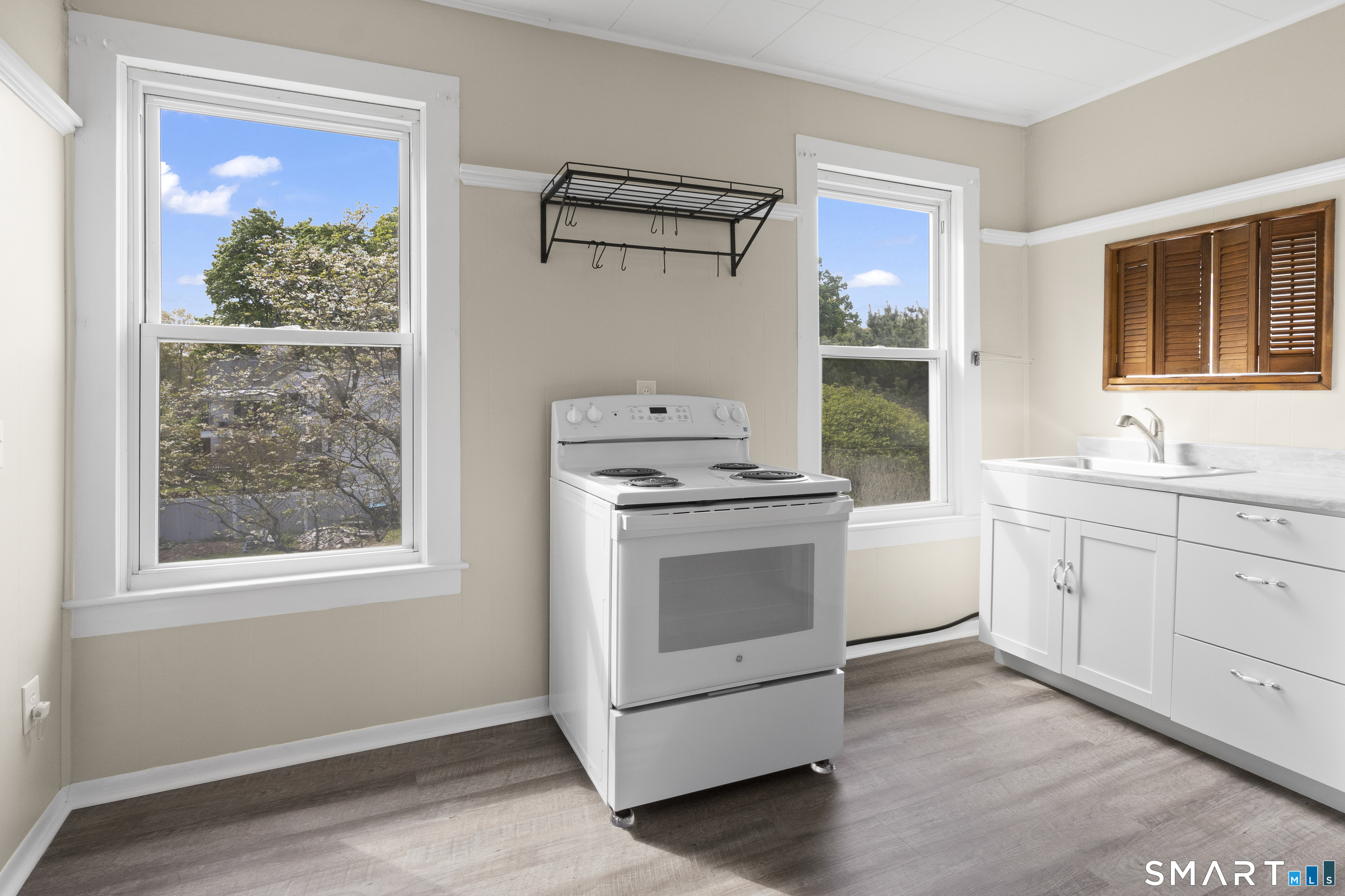 198 South Main Street Putnam, CT 06260 - Photo 4 of 21 a kitchen with white cabinets and window