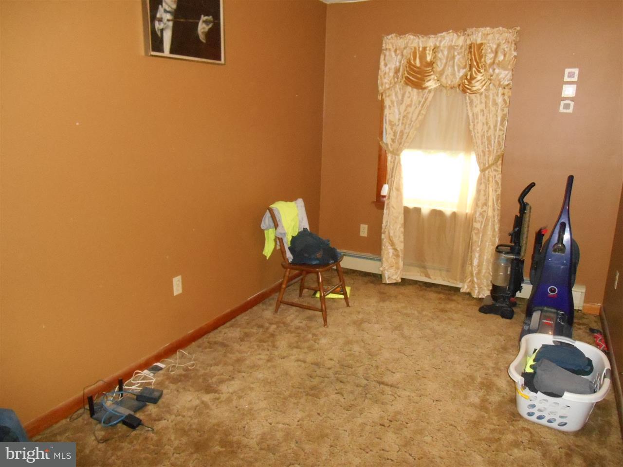 3084 Tommys Road Brogue, PA 17309 - Photo 5 of 11 a living room with furniture and a flat screen tv