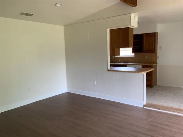 a kitchen with a sink and microwave