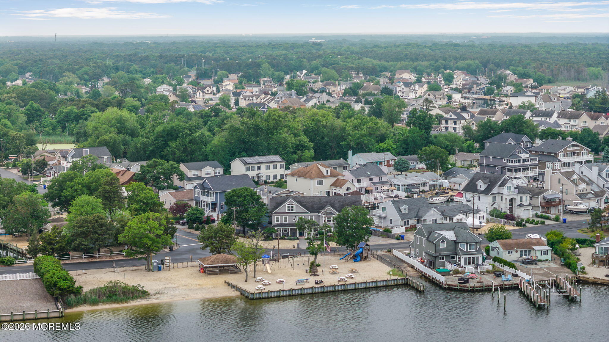 9 Cross Trees Road Brick, NJ 08723 - Photo 115 of 126 an aerial view of a city with lots of residential buildings ocean and mountain view in back