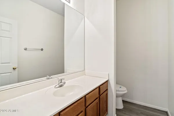 a bathroom with a sink toilet and vanity