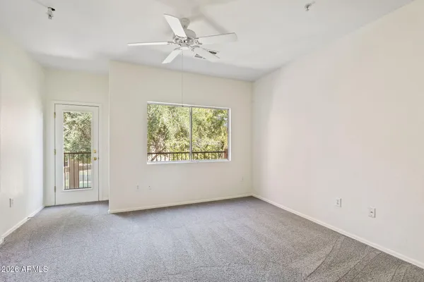 a view of an empty room with a window