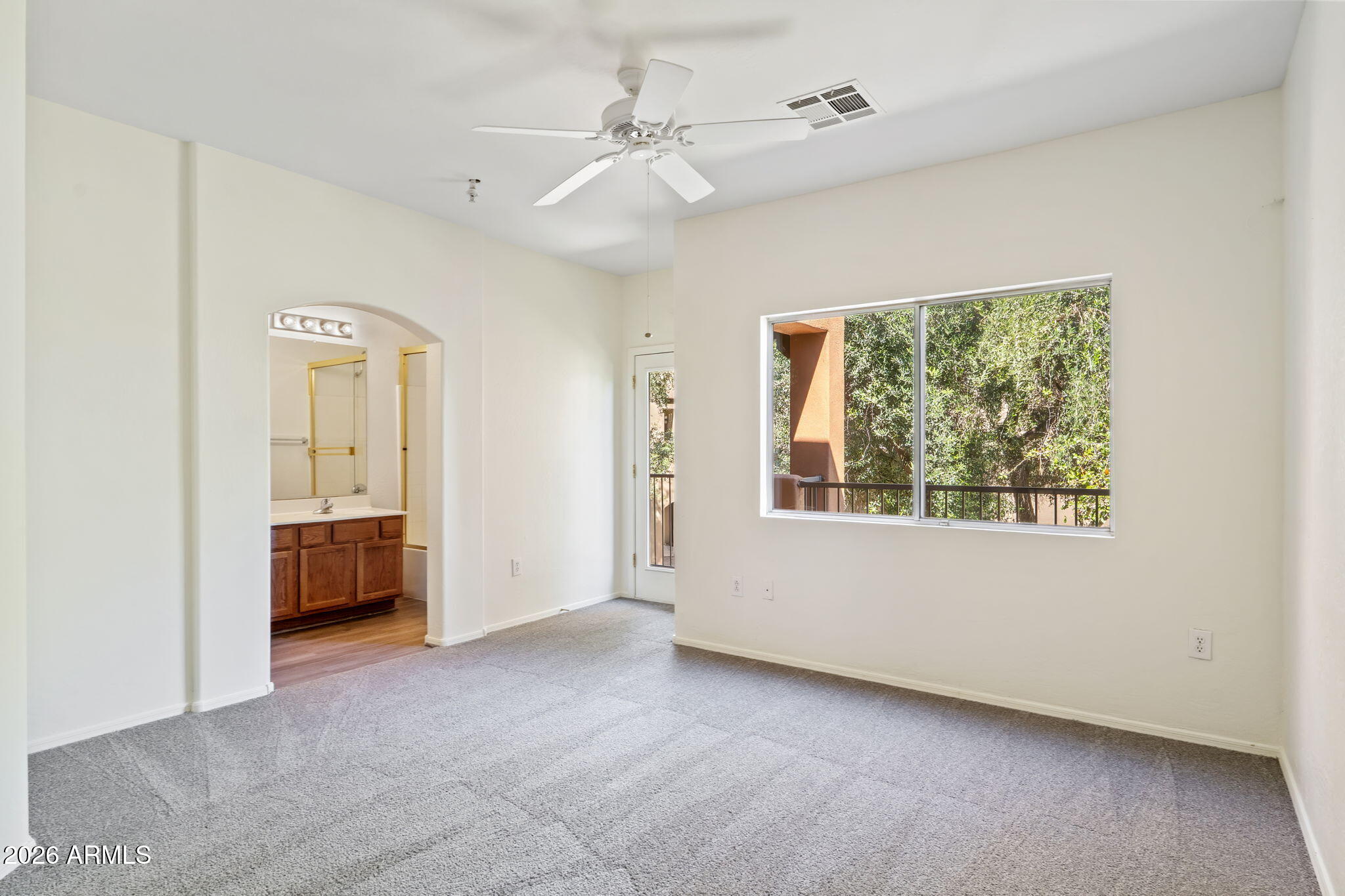 1718 West Colter Street, Unit 126 Phoenix, AZ 85015 - Photo 15 of 29 a view of an empty room with a window
