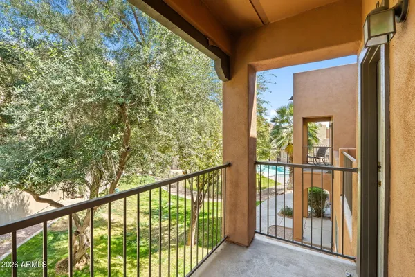 a view of a balcony with wooden floor
