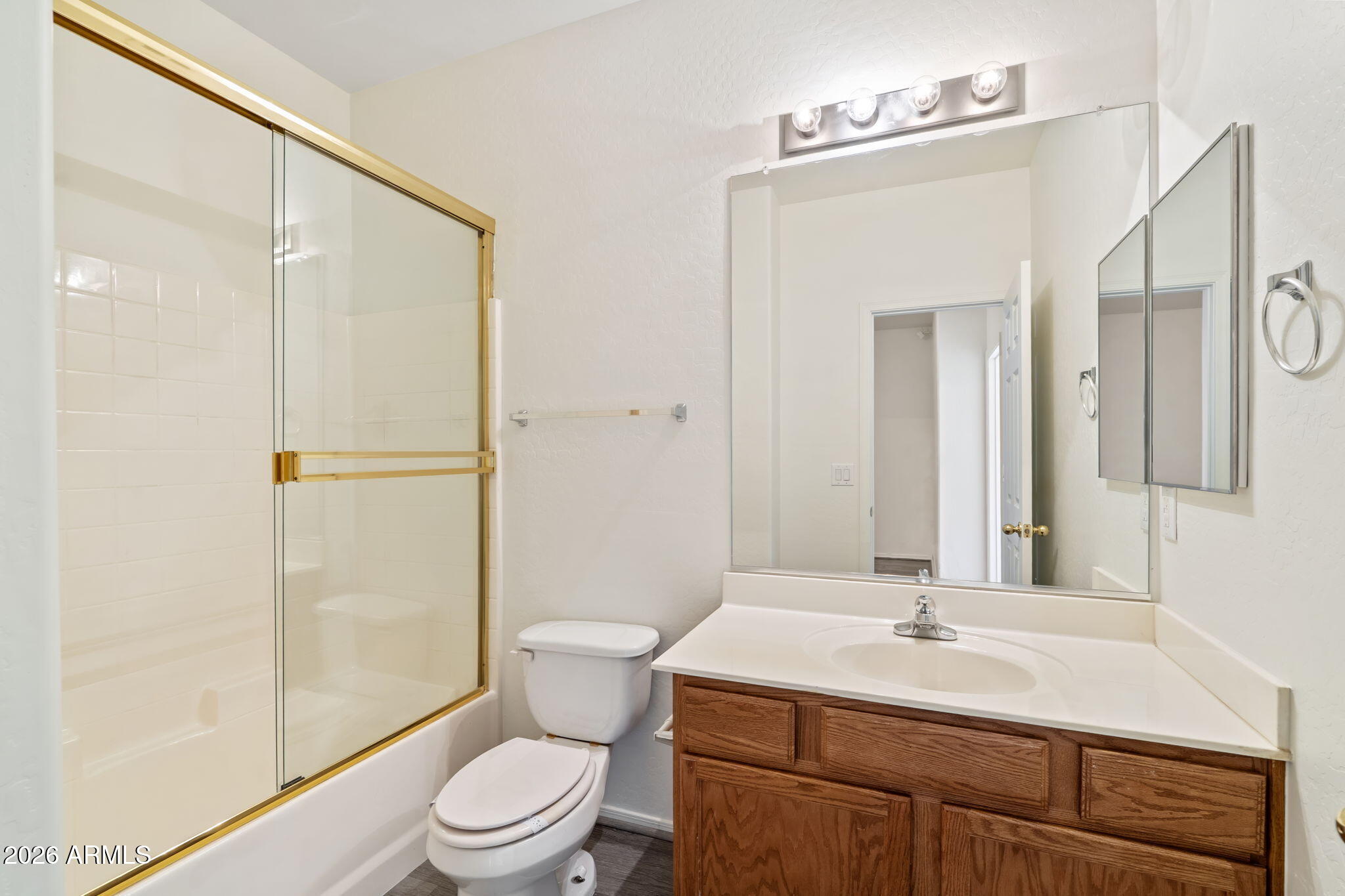 1718 West Colter Street, Unit 126 Phoenix, AZ 85015 - Photo 26 of 29 a bathroom with a sink a toilet and shower