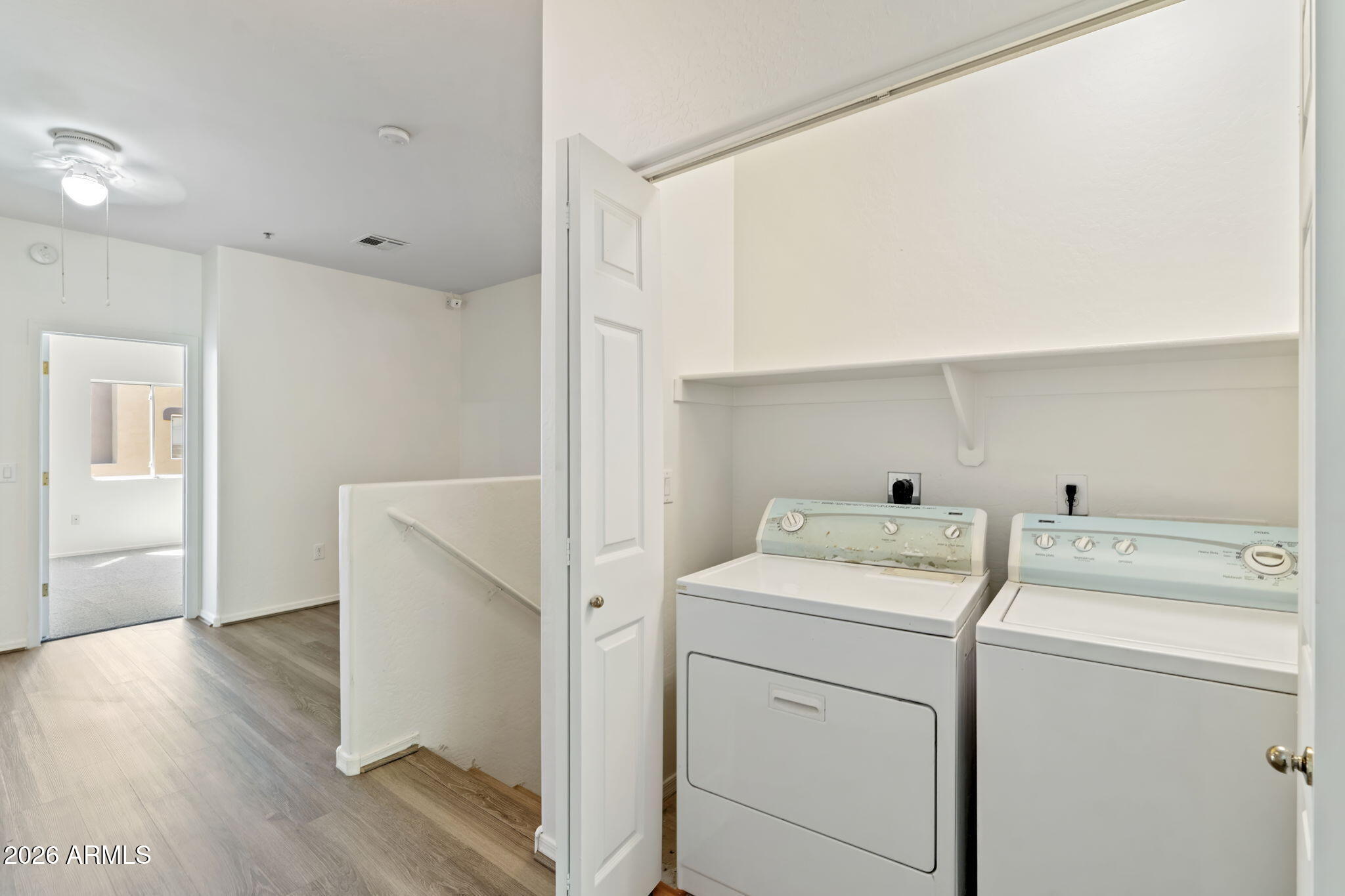 1718 West Colter Street, Unit 126 Phoenix, AZ 85015 - Photo 27 of 29 a view of storage and utility room with washer and dryer