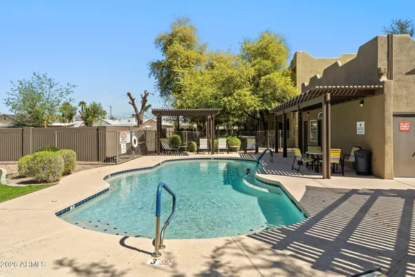 a view of a swimming pool with patio