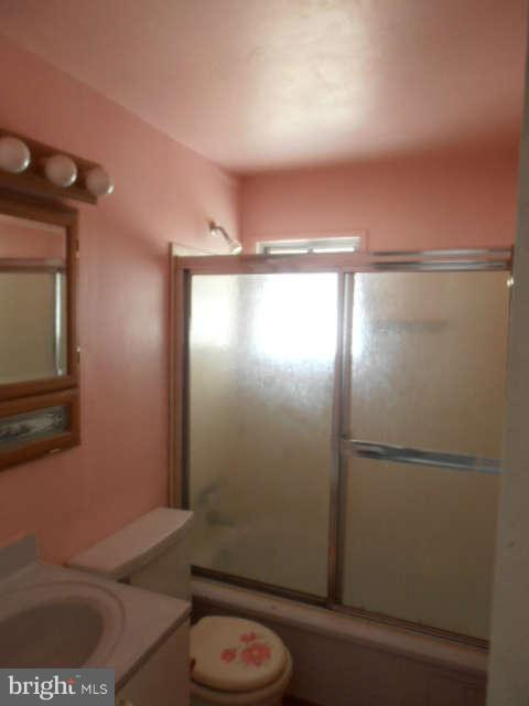 2022 Larkhall Road Dundalk, MD 21222 - Photo 5 of 10 a bathroom with a sink and a mirror