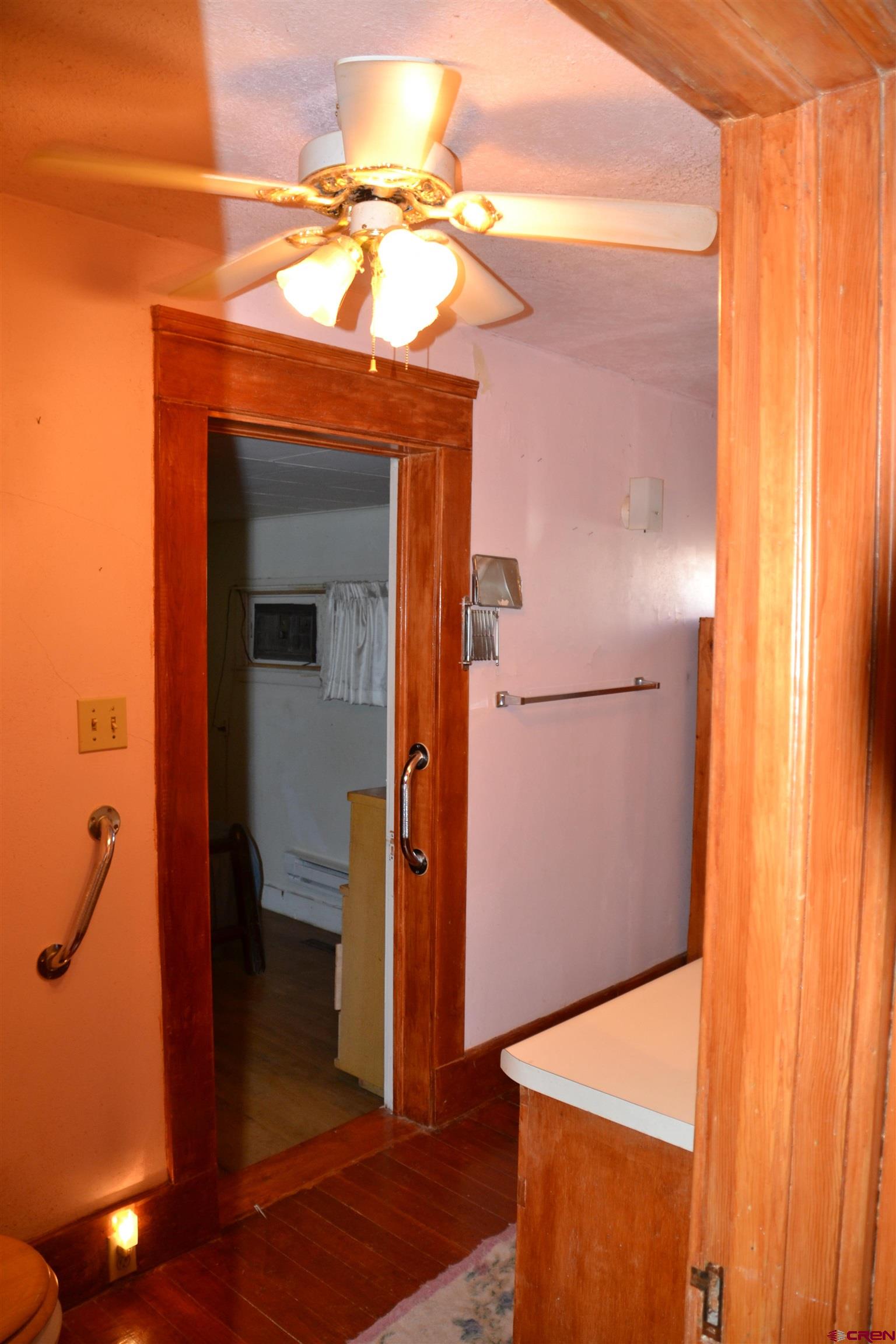 21964 Austin Road Austin, CO 81410 - Photo 15 of 33 a bathroom with a mirror and a shower