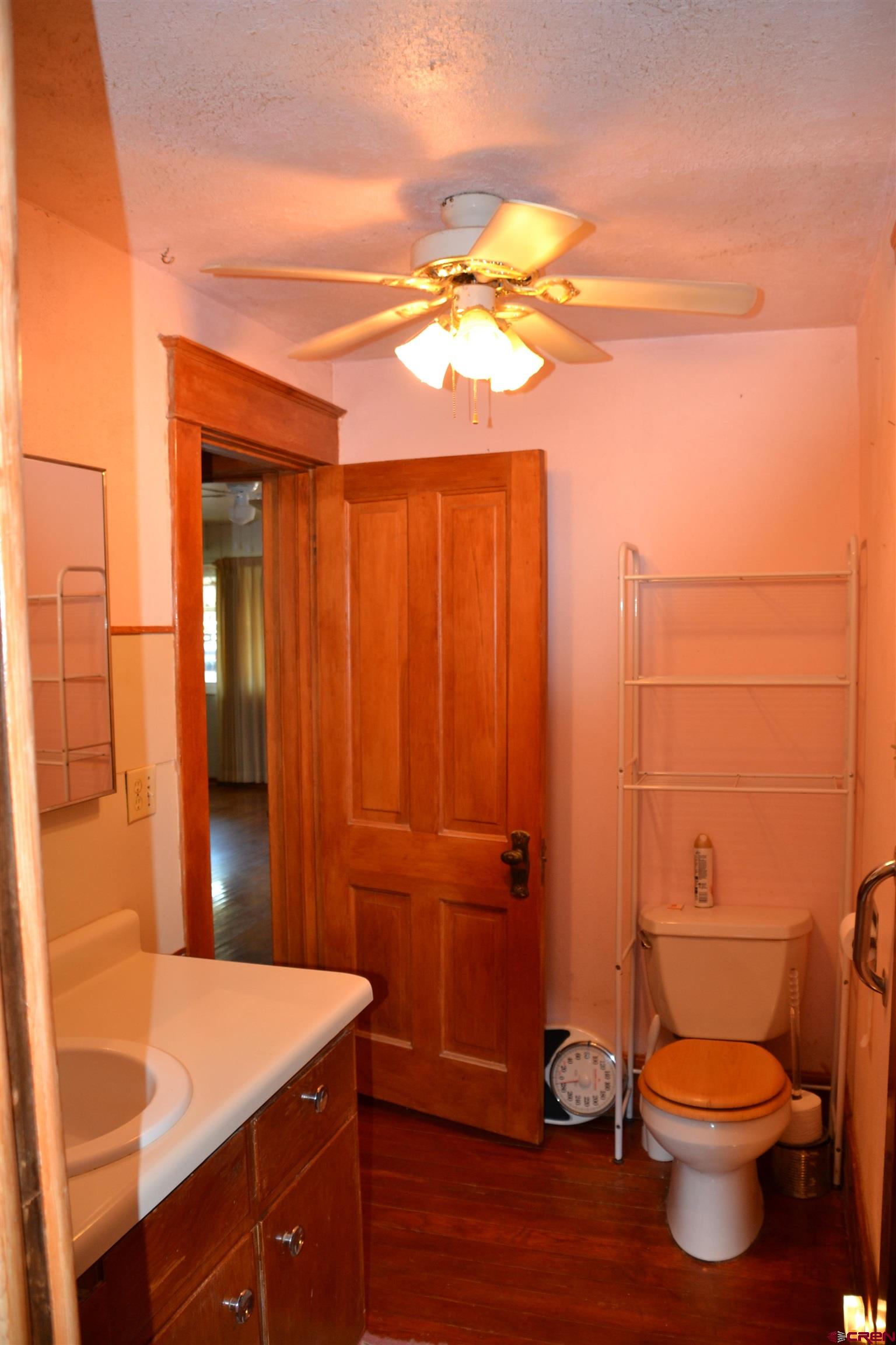 21964 Austin Road Austin, CO 81410 - Photo 16 of 33 a bathroom with a sink a toilet and shower