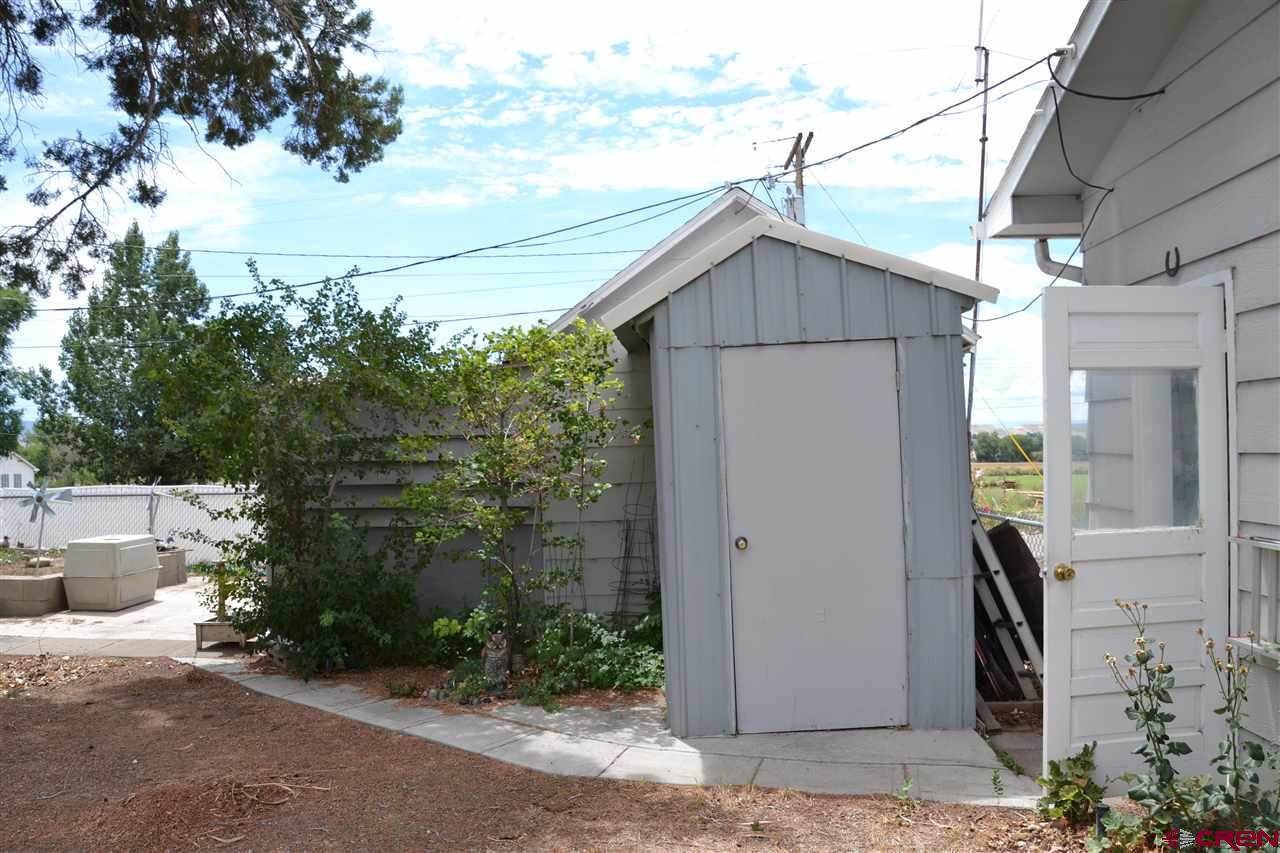 21964 Austin Road Austin, CO 81410 - Photo 28 of 33 a backyard of a house