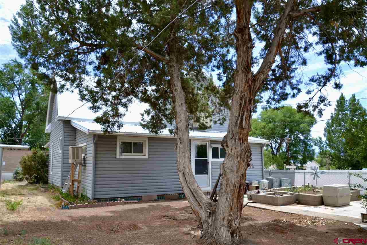 21964 Austin Road Austin, CO 81410 - Photo 32 of 33 a view of a house with a tree in the background