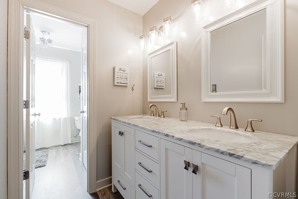 5311 Meadow Chase Road Midlothian, VA 23112 - Photo 42 of 49 a bathroom with a granite countertop sink and a mirror