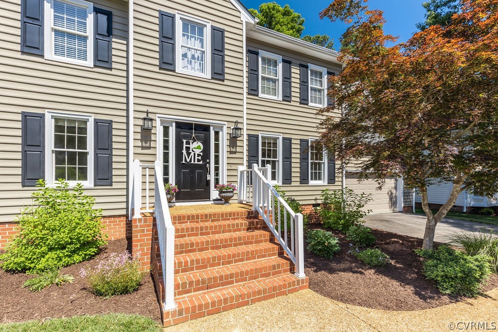 5311 Meadow Chase Road Midlothian, VA 23112 - Photo 7 of 49 a front view of a house with a yard